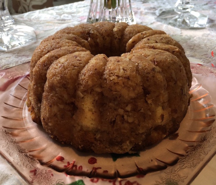 A bundt cake on a decorative plate.