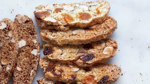 Close-up of sliced nut and fruit bread.