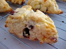 Close-up of a freshly baked scone with raisins.
