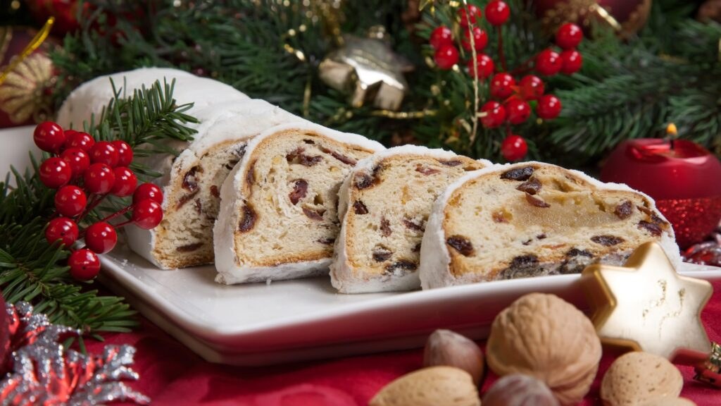 Sliced stollen with festive holiday decorations.