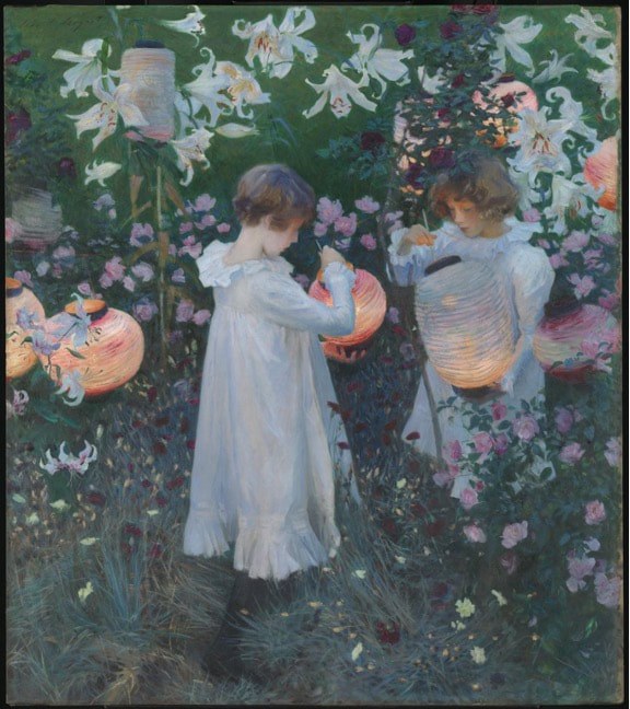 Two children picking flowers in a lush garden.