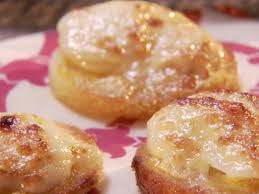 Close-up of glazed cinnamon sugar pastries on a pink plate.