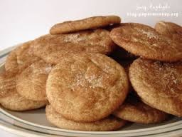 Plate of cinnamon sugar cookies stacked together.