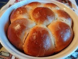 Golden brown braided bread rolls fresh from the oven.