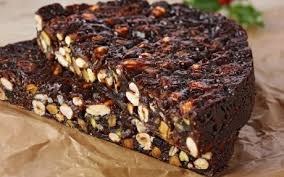 A rich chocolate nut brownie bar with a glossy top.