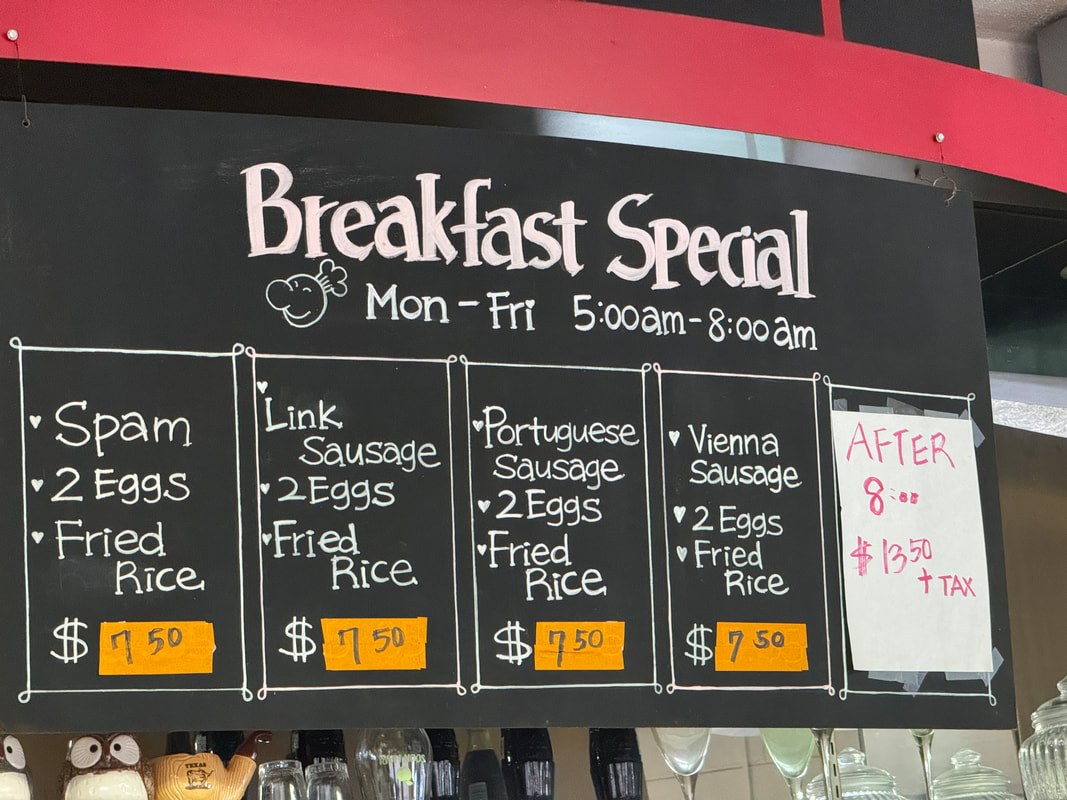 Breakfast special menu with various egg and meat options and prices.