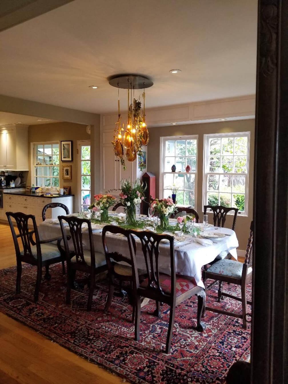 Elegant dining room with a beautifully set table and warm lighting.