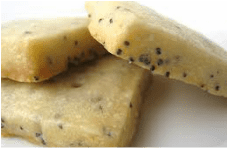 Close-up of chocolate chip cookie dough pieces.