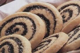 Close-up of spiral-shaped cookies with chocolate filling.