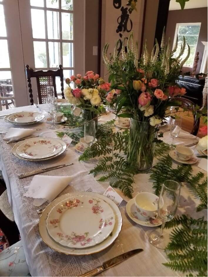 Elegant table setting with floral centerpiece.