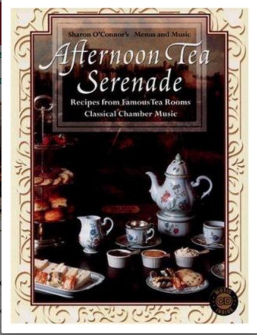 Vintage tea set with pastries on a table, evoking a classic afternoon tea.