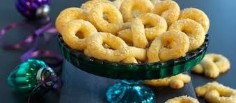 Golden fried snacks served on a blue glass pedestal dish.