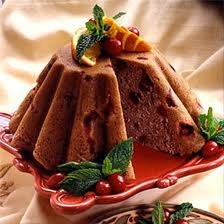 Delicious chocolate bundt cake garnished with mint and cherries.