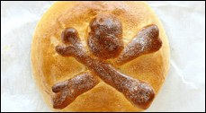 Bread loaf with a skull and crossbones design on top.