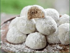 Powdered sugar-coated cookie balls with a nutty filling inside.