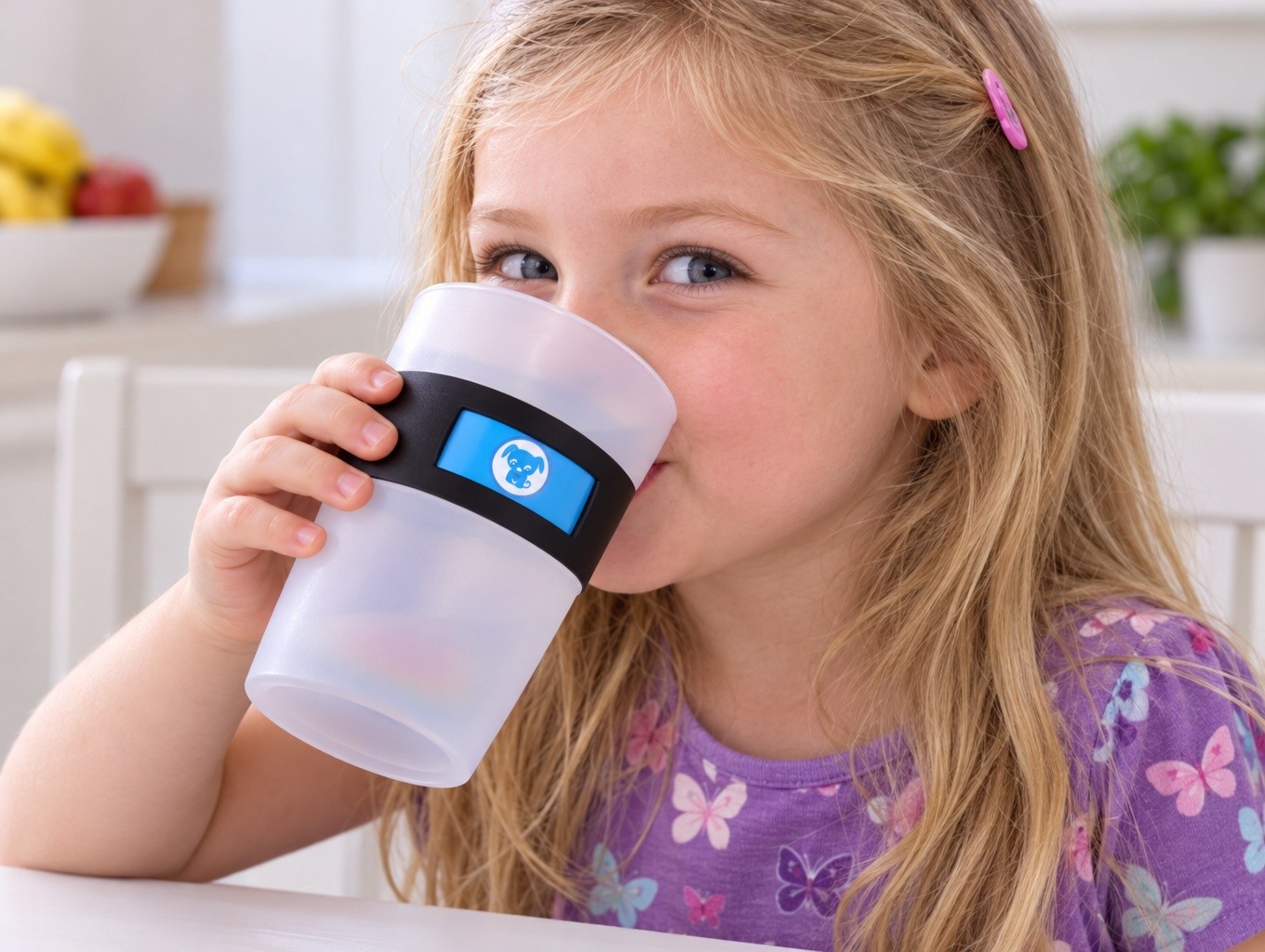 A young child drinking from a cup