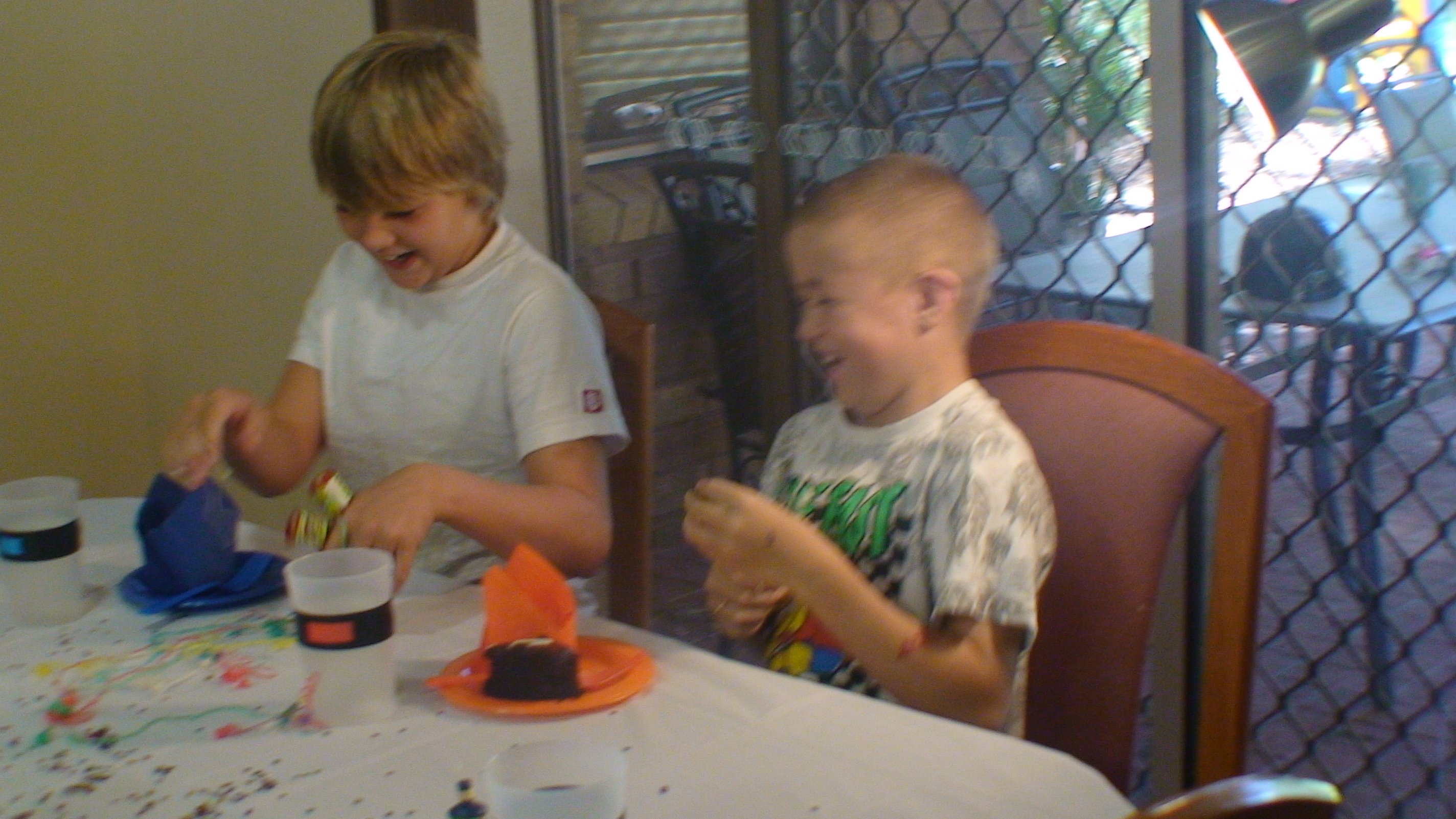 Children enjoying a birthday party with a MyColourCup on the table