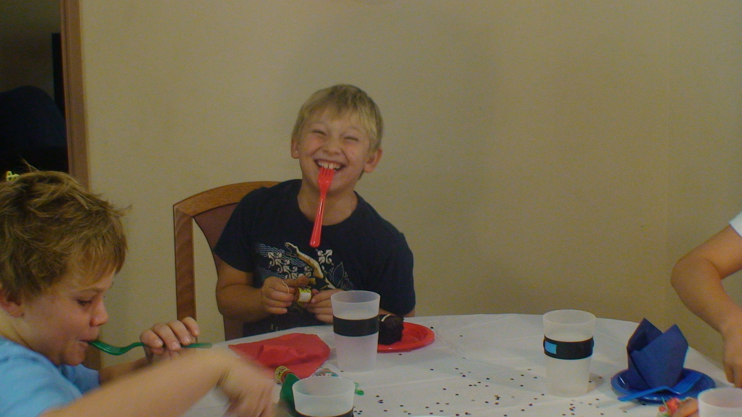 Children at a party table with MyColourCups set to different colors