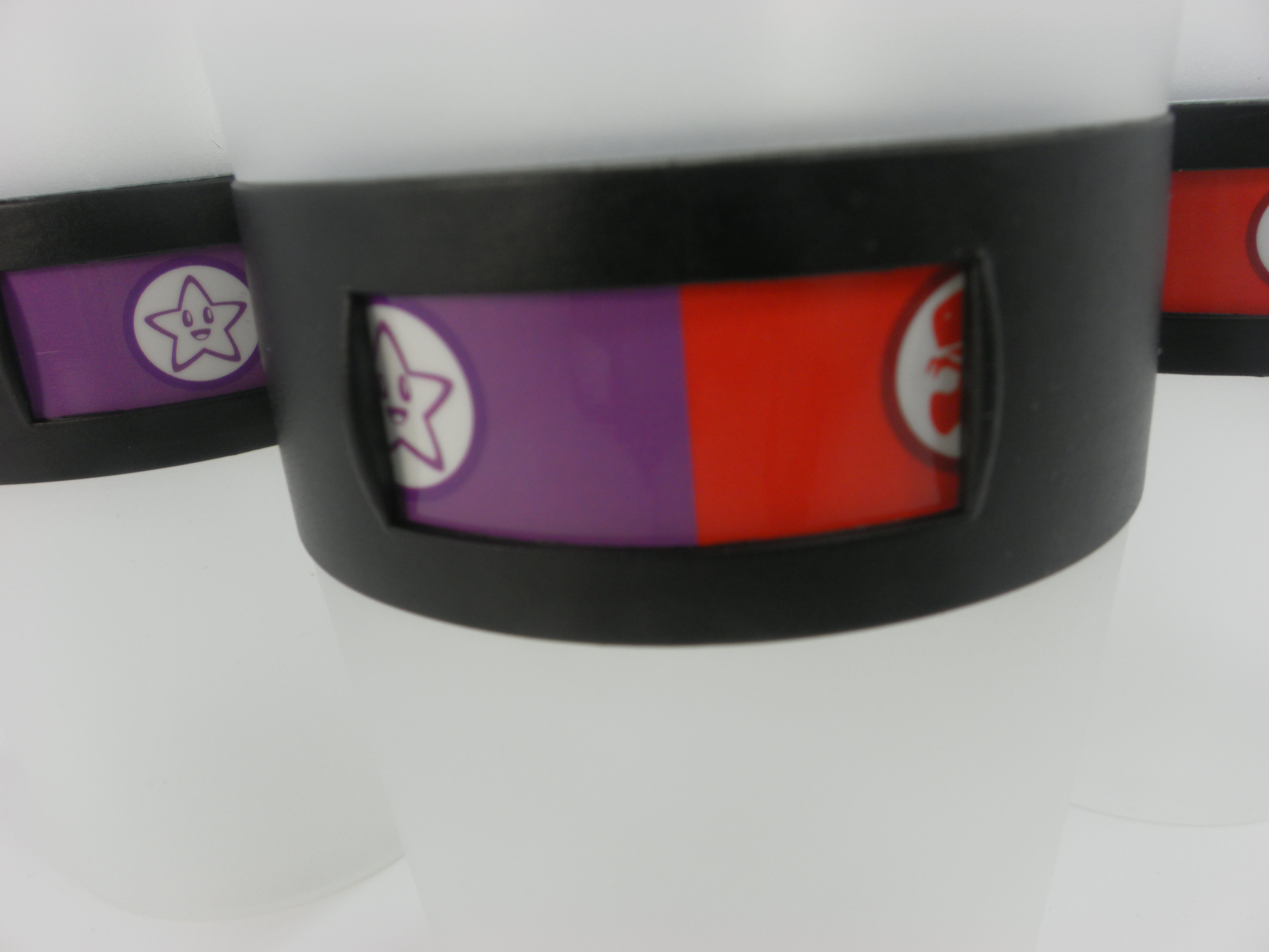 Close-up of MyColourCup rotating bands with colorful character choices