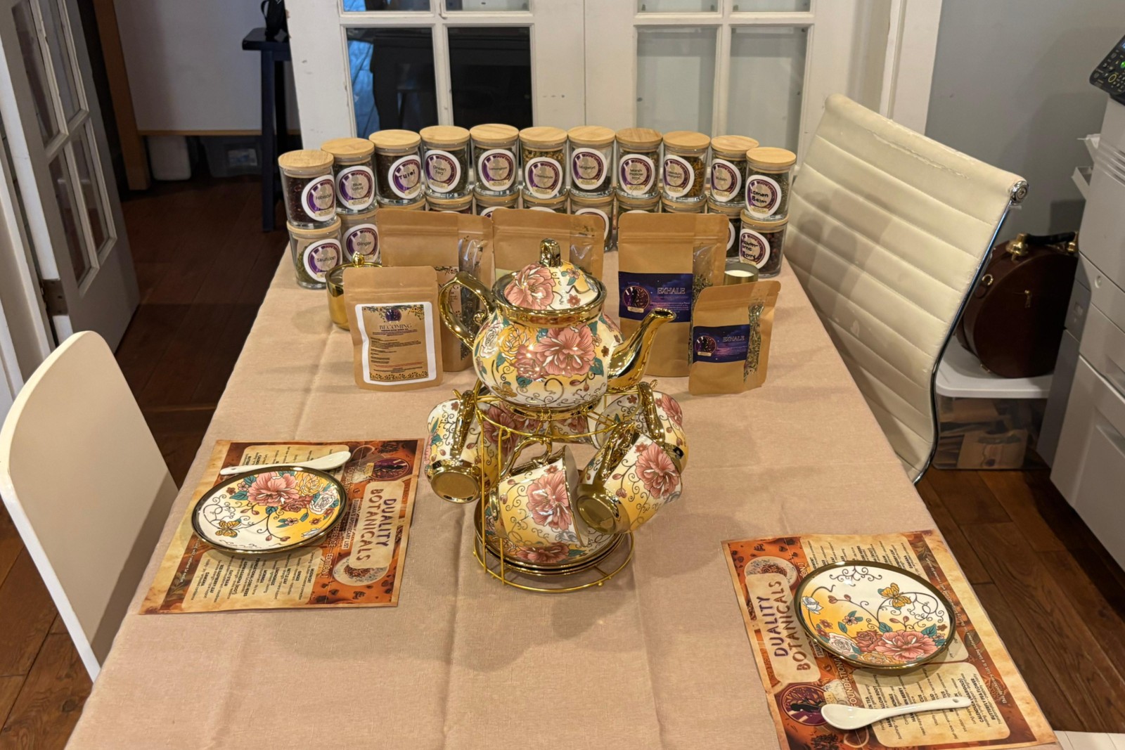 Duality tea blends and floral teaware arranged for a gathering