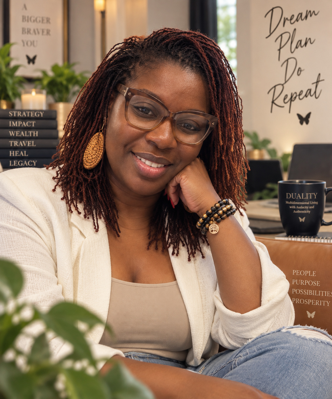 Tijuana Fulford smiling in a cream jacket in her workspace