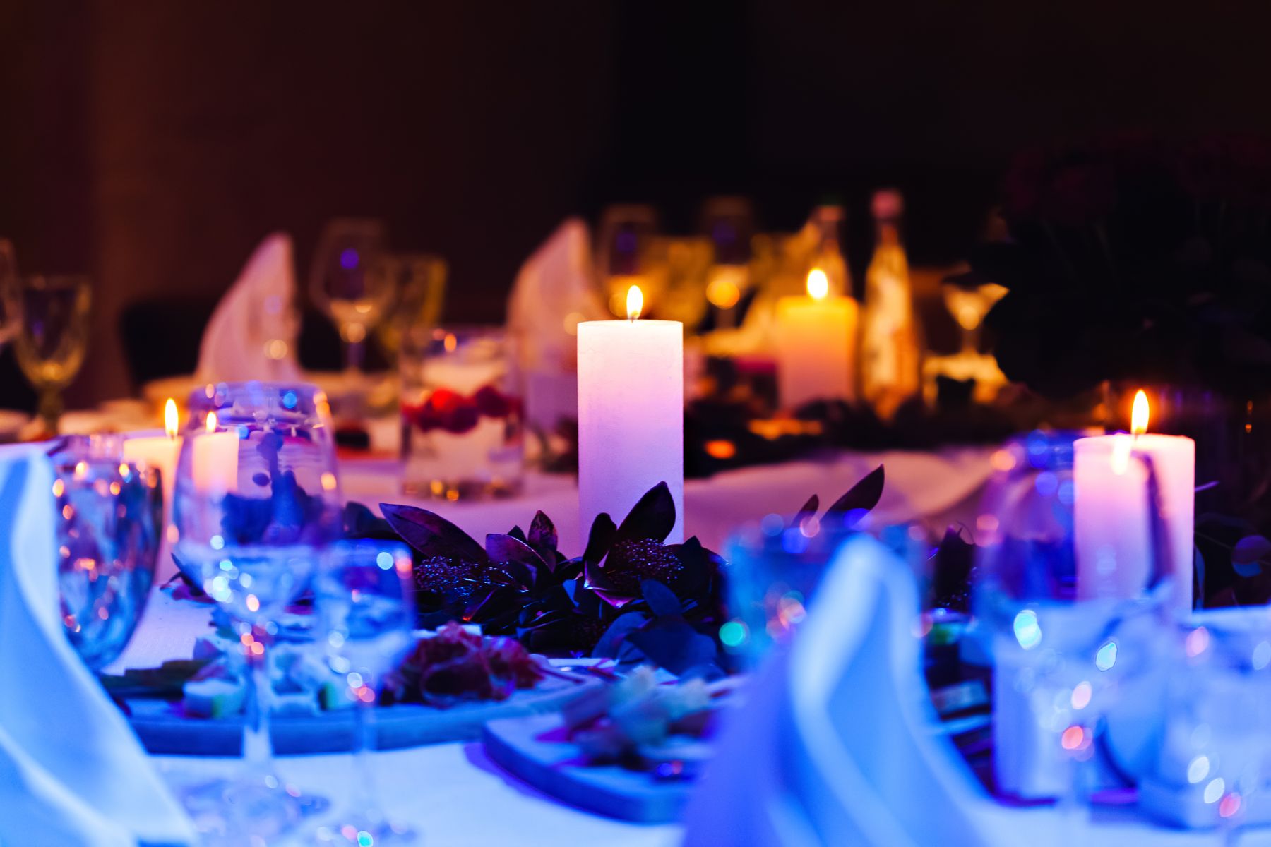 Candlelit dinner table set for a romantic evening