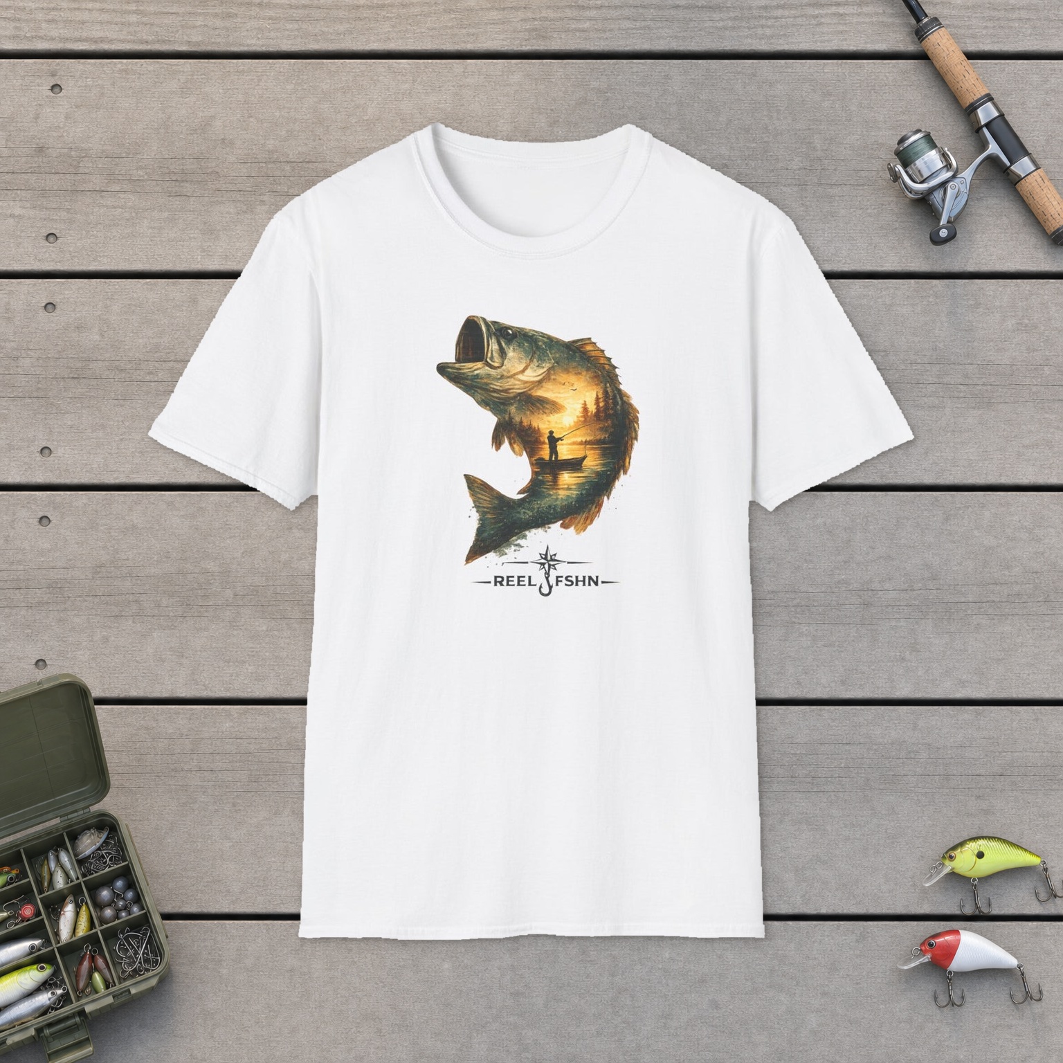Bass Leaped At Golden Hour T-Shirt on a wooden dock with a fishing rod, reel, tackle box, and two lures