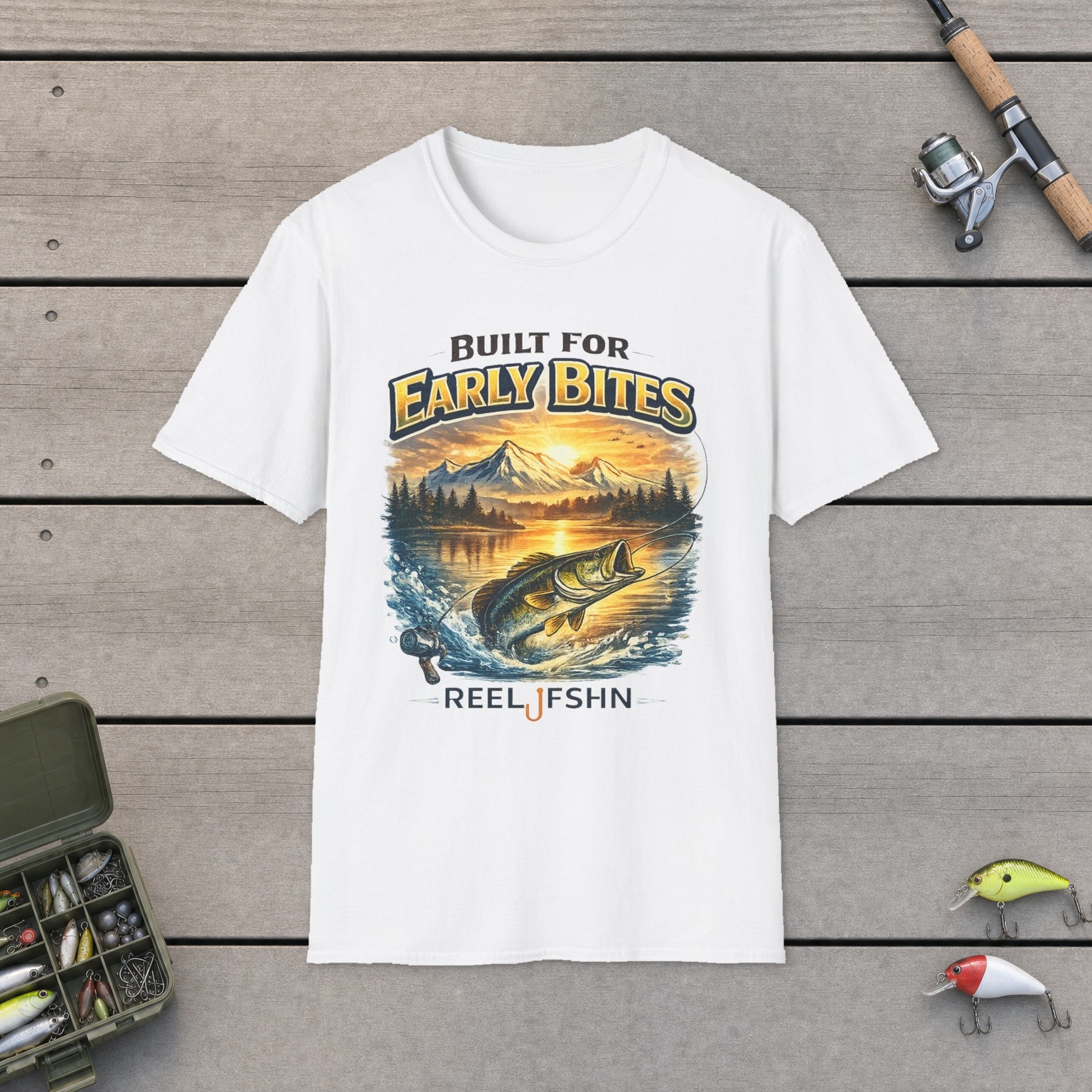 "Built for Early Bites" T-Shirt on a wooden dock with a fishing rod, reel, tackle box, and two lures