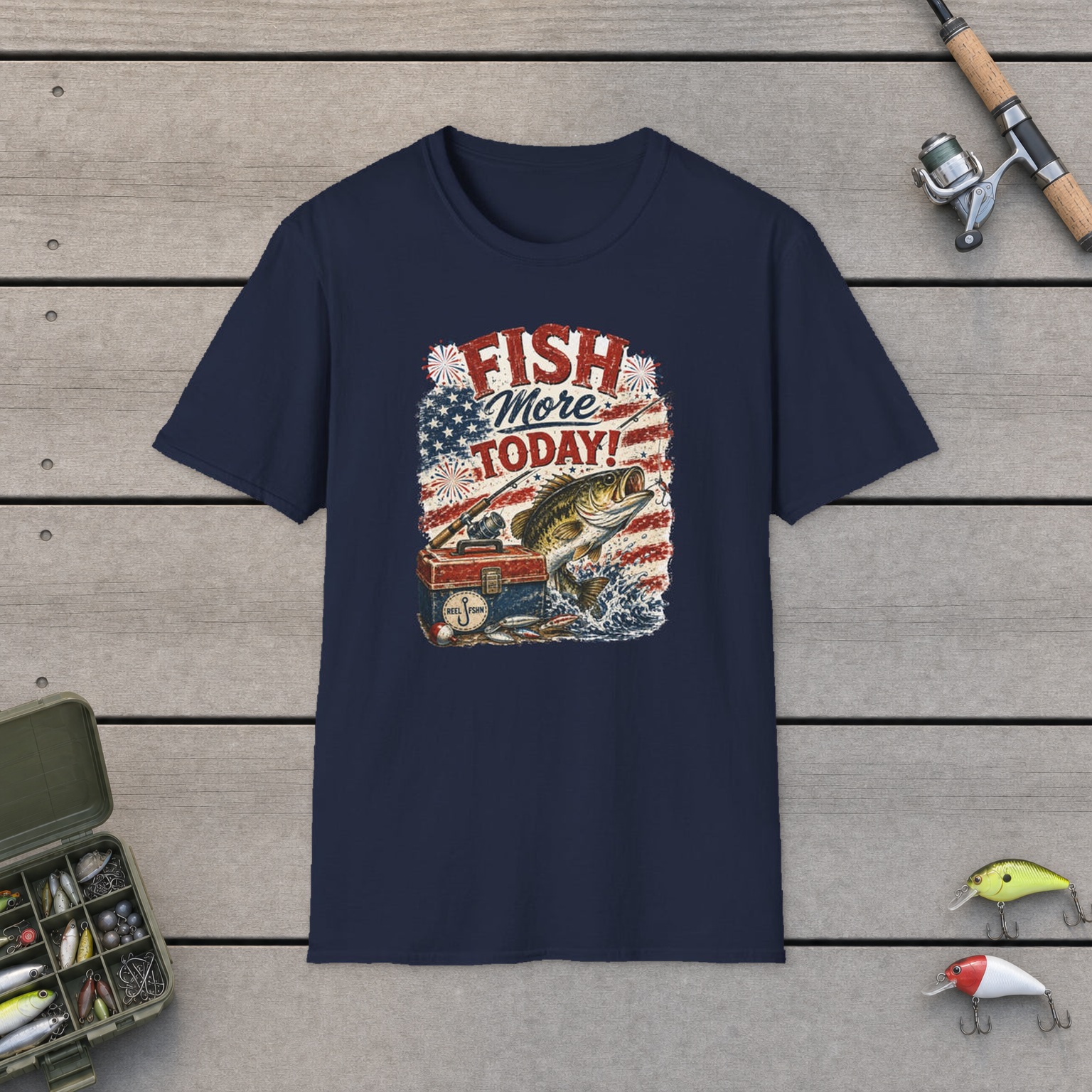 Fish More. TODAY! T-Shirt on a wooden dock with a fishing rod, reel, tackle box, and two lures
