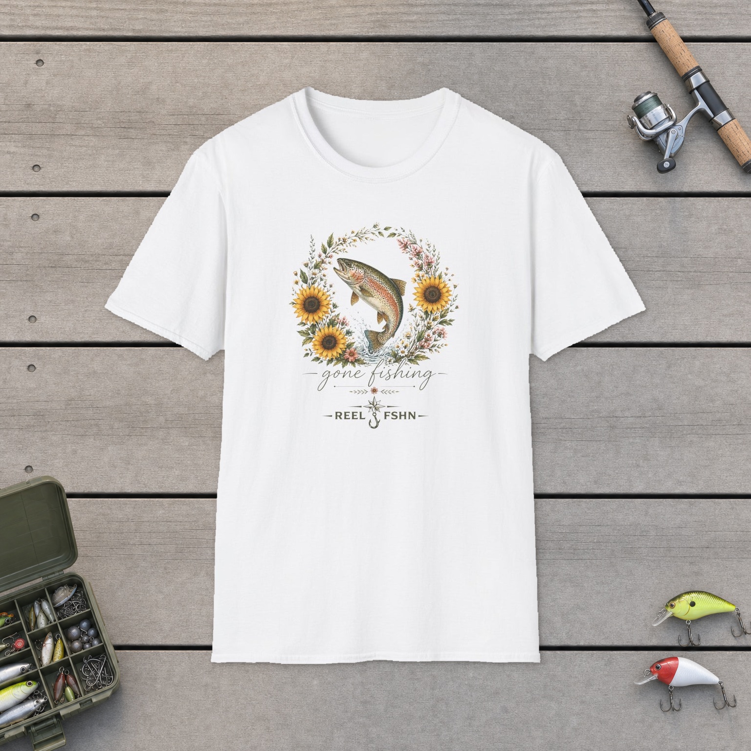 Gone Fishing Female T-Shirt on a wooden dock with a fishing rod, reel, tackle box, and two lures