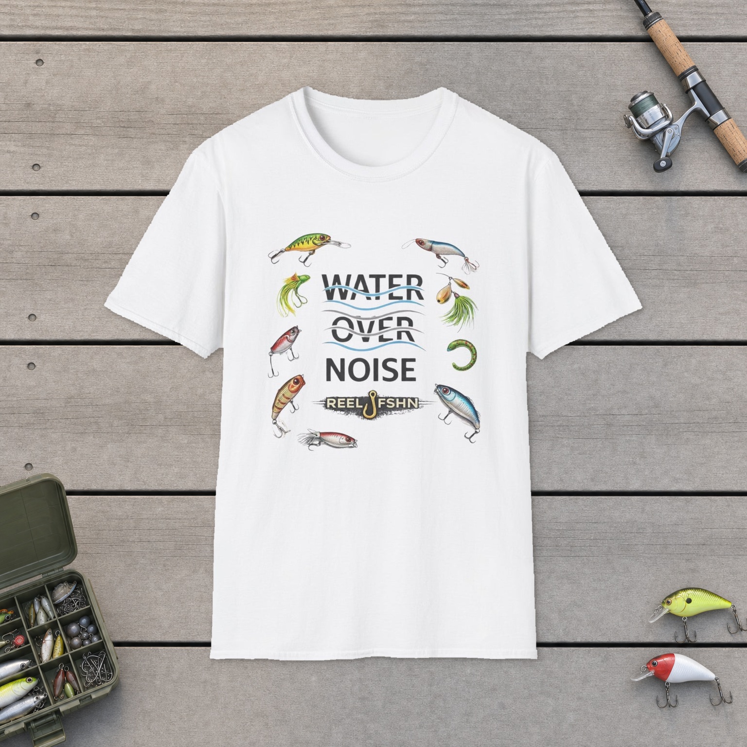 Water Over Noise T-Shirt on a wooden dock with a fishing rod, reel, tackle box, and two lures
