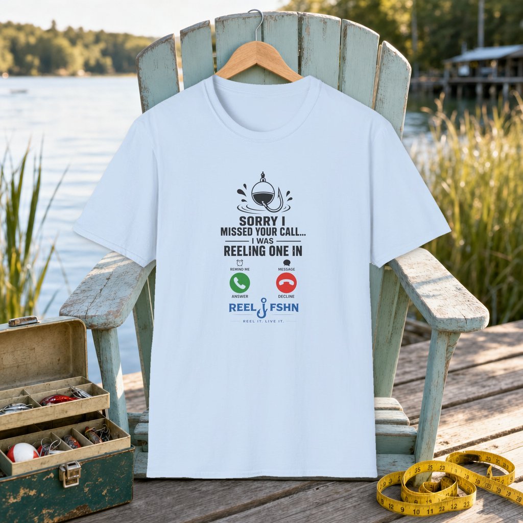 Sorry I Missed Your Call I Was Reeling One In T-Shirt on a hanger on a seafoam fishing chair beside a lake, tackle box, and measuring tape