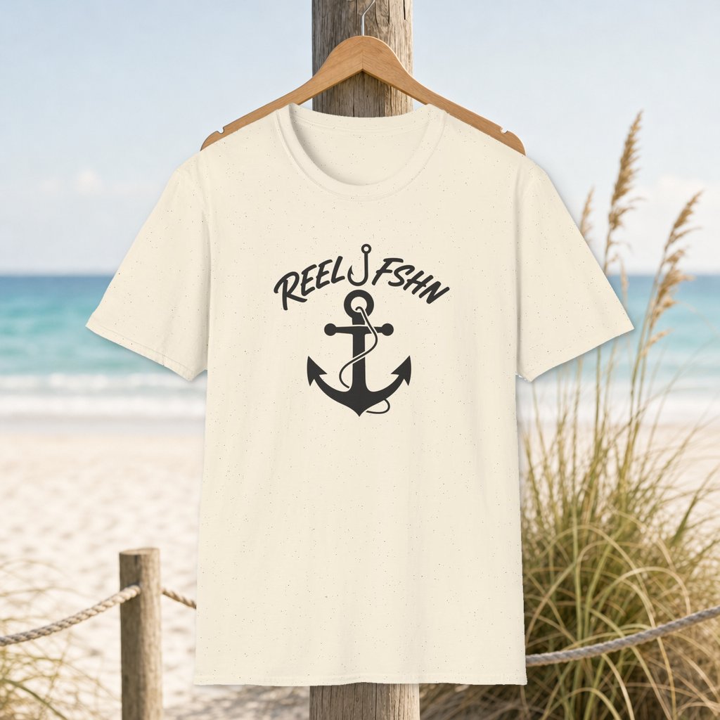 Anchor & Rope T-Shirt on a hanger beside a sandy beach and turquoise coastal water