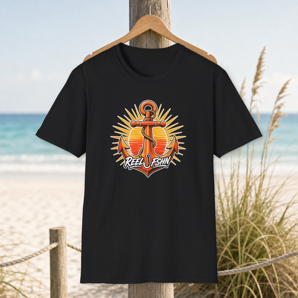 Anchor with Logo T-Shirt on a hanger beside a sandy beach and turquoise coastal water