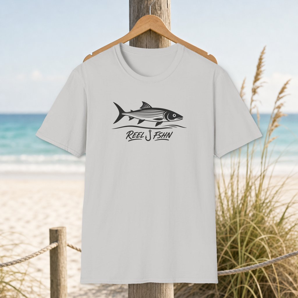 Bonefish Flats T-Shirt on a hanger beside a sandy beach and turquoise coastal water