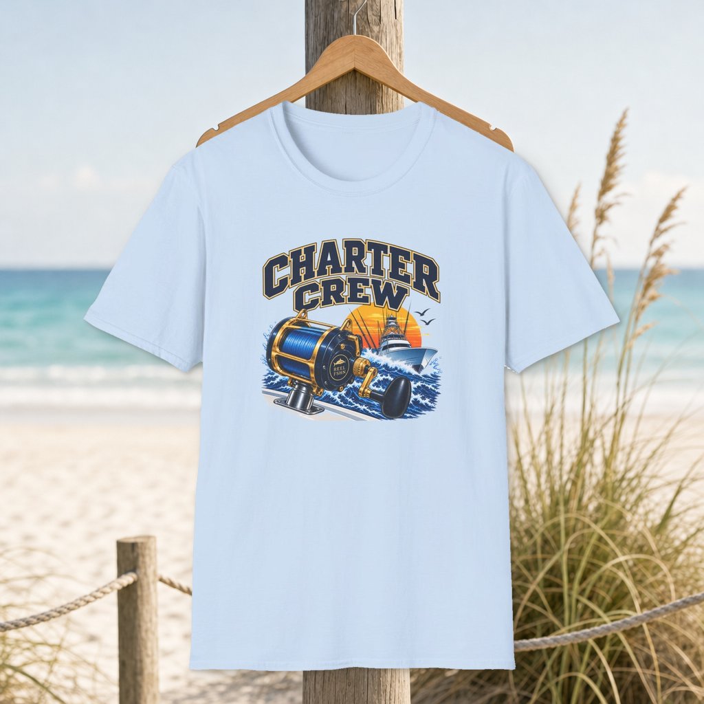 Charter Crew T-Shirt on a hanger beside a sandy beach and turquoise coastal water