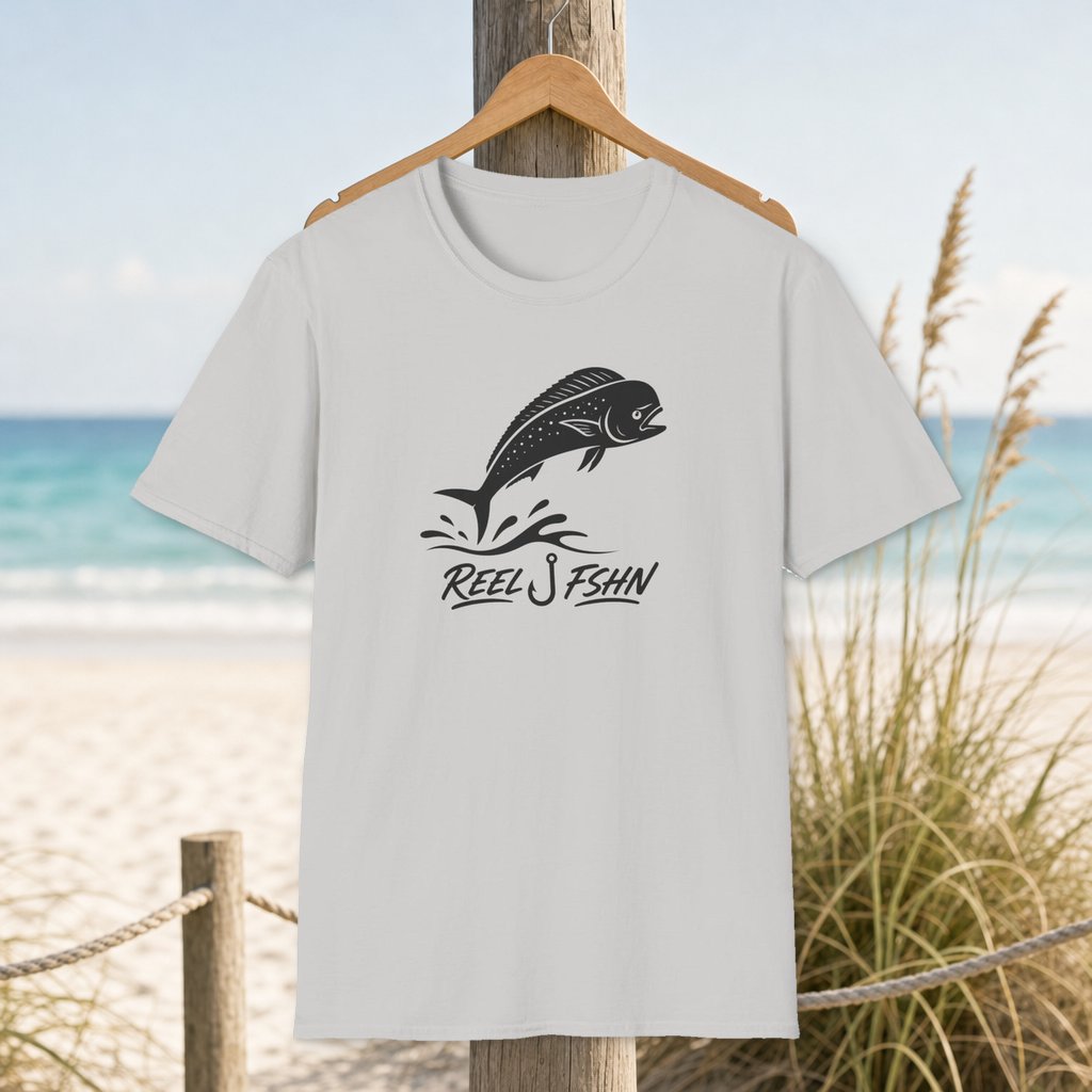 Dorado Leap Cutline T-Shirt on a hanger beside a sandy beach and turquoise coastal water