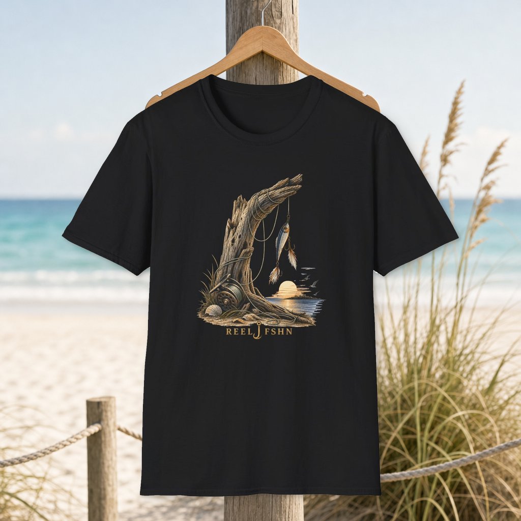 Driftwood & Line T-Shirt on a hanger beside a sandy beach and turquoise coastal water