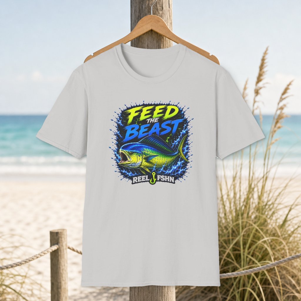 Feed The Beast  T-Shirt on a hanger beside a sandy beach and turquoise coastal water