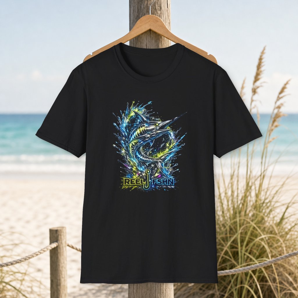 Geometric Marlin T-Shirt on a hanger beside a sandy beach and turquoise coastal water