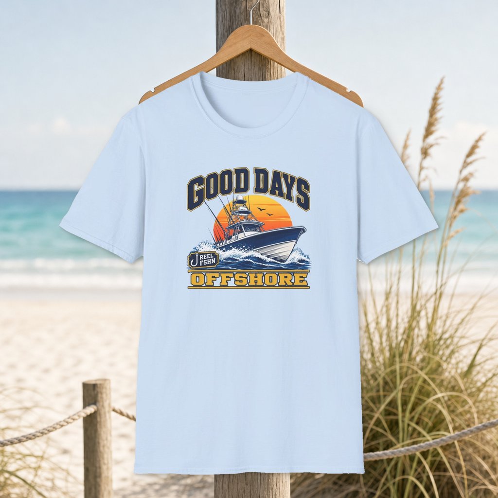 Good Days Offshore T-Shirt on a hanger beside a sandy beach and turquoise coastal water