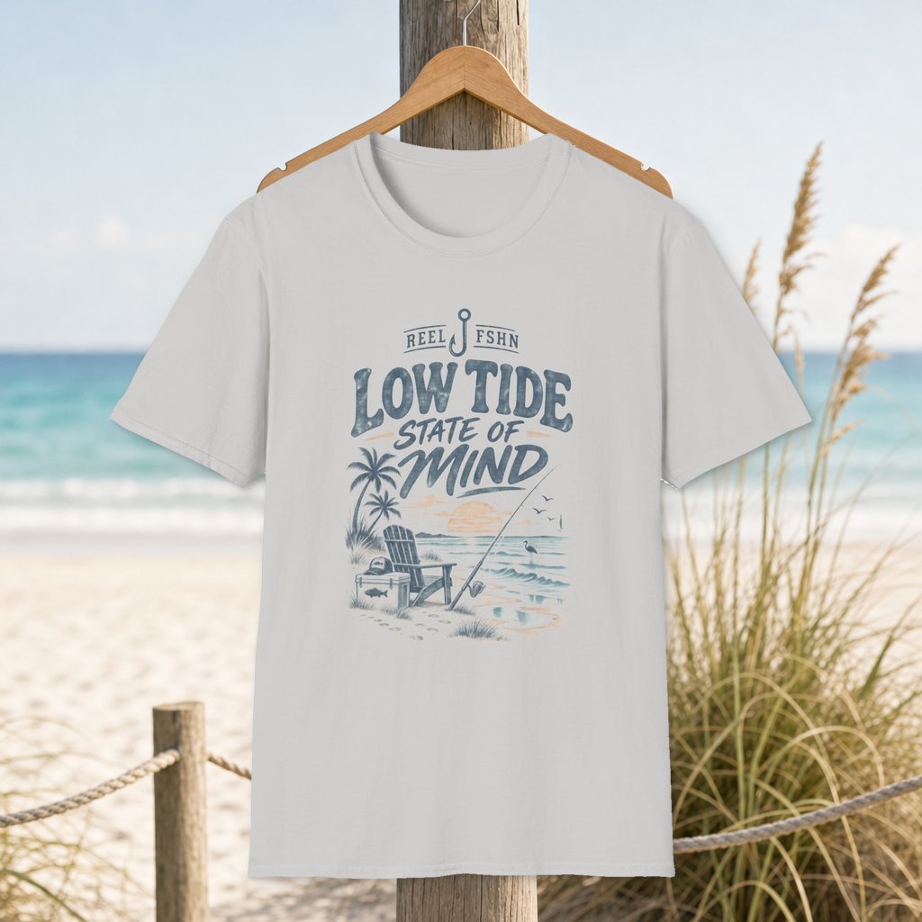 Low Tide State Of Mind T-Shirt on a hanger beside a sandy beach and turquoise coastal water