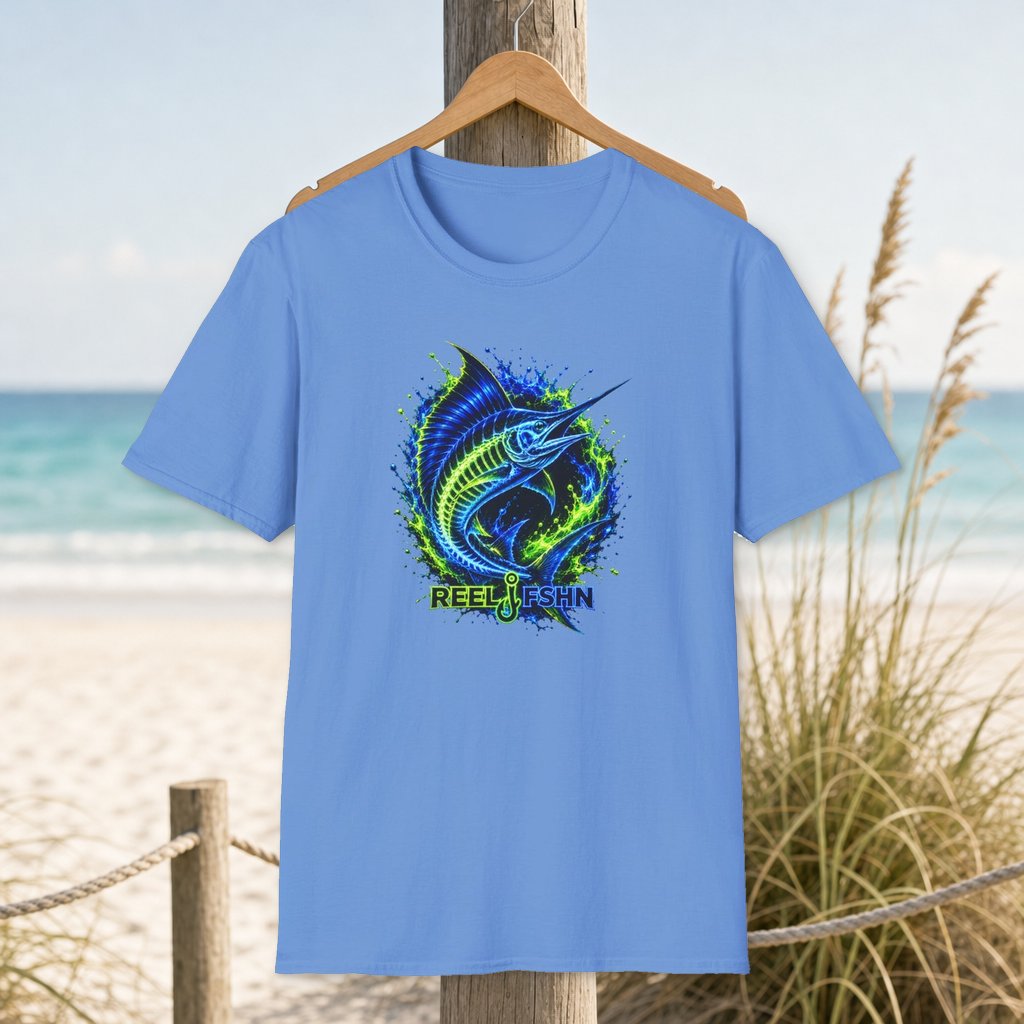 Neon Marlin T-Shirt on a hanger beside a sandy beach and turquoise coastal water