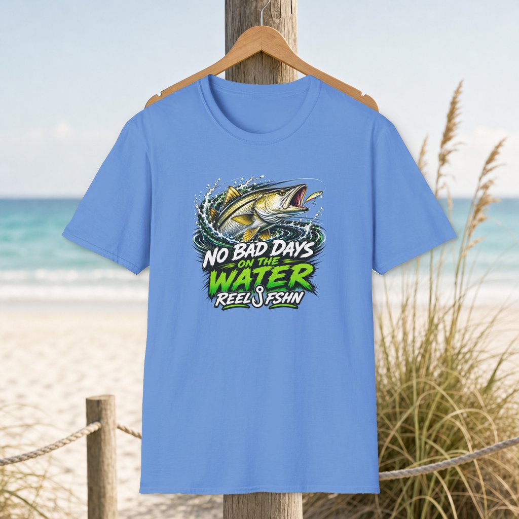 No Bad Days On The Water T-Shirt on a hanger beside a sandy beach and turquoise coastal water