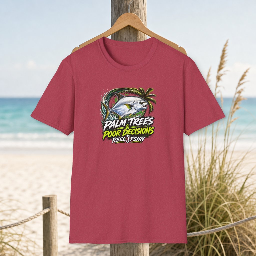 Palm Trees & Poor Decisions T-Shirt on a hanger beside a sandy beach and turquoise coastal water