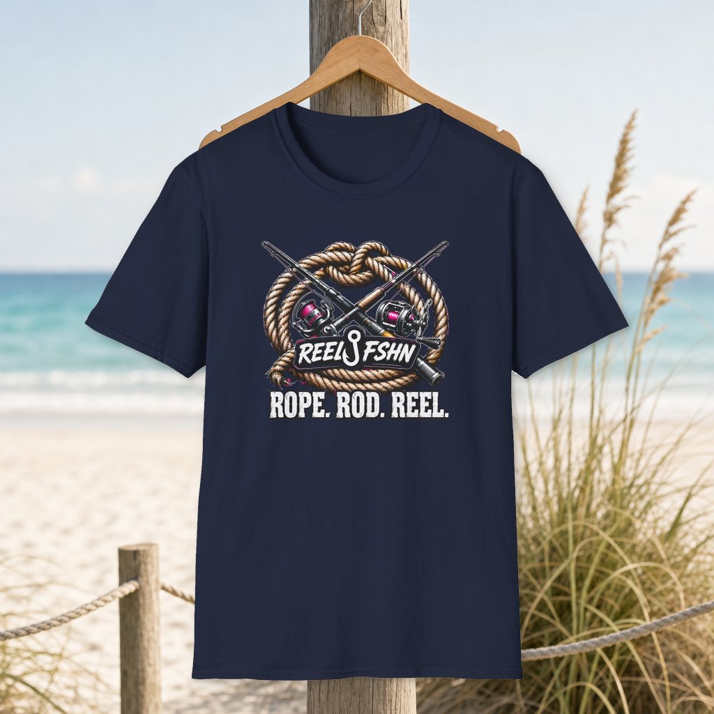 Rope. Rod. Reel. T-Shirt on a hanger beside a sandy beach and turquoise coastal water