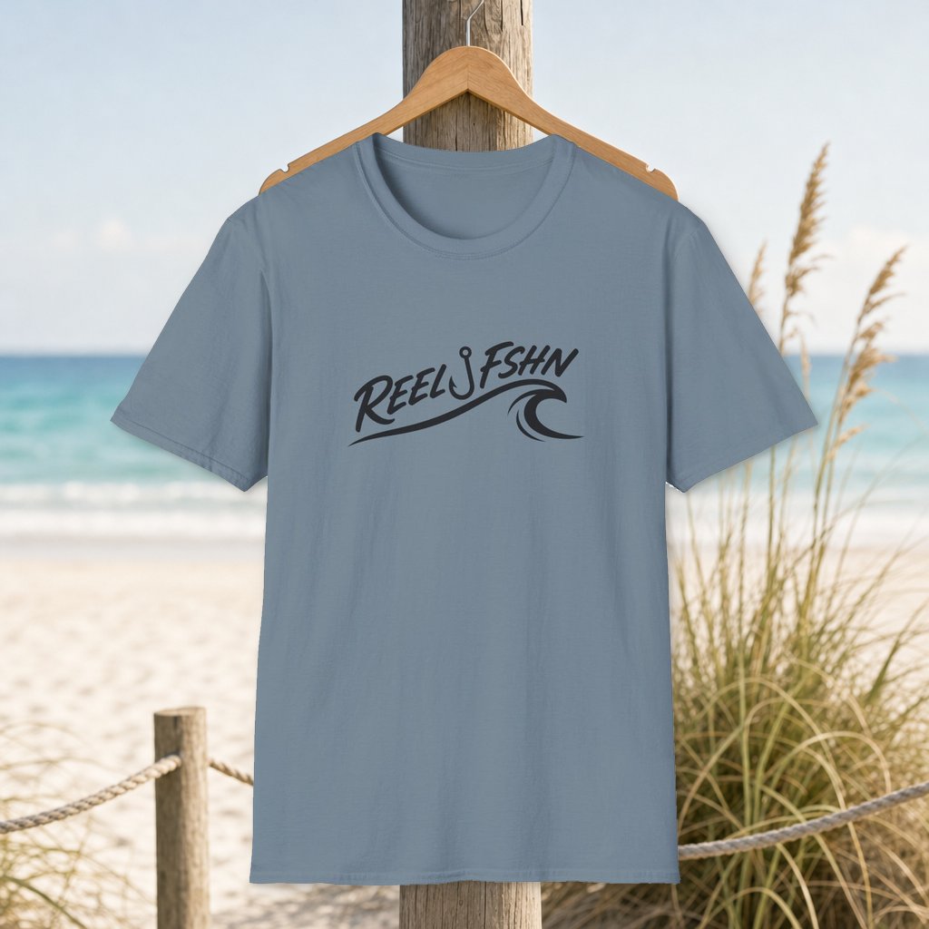Wave Crest Decal with Logo T-Shirt on a hanger beside a sandy beach and turquoise coastal water
