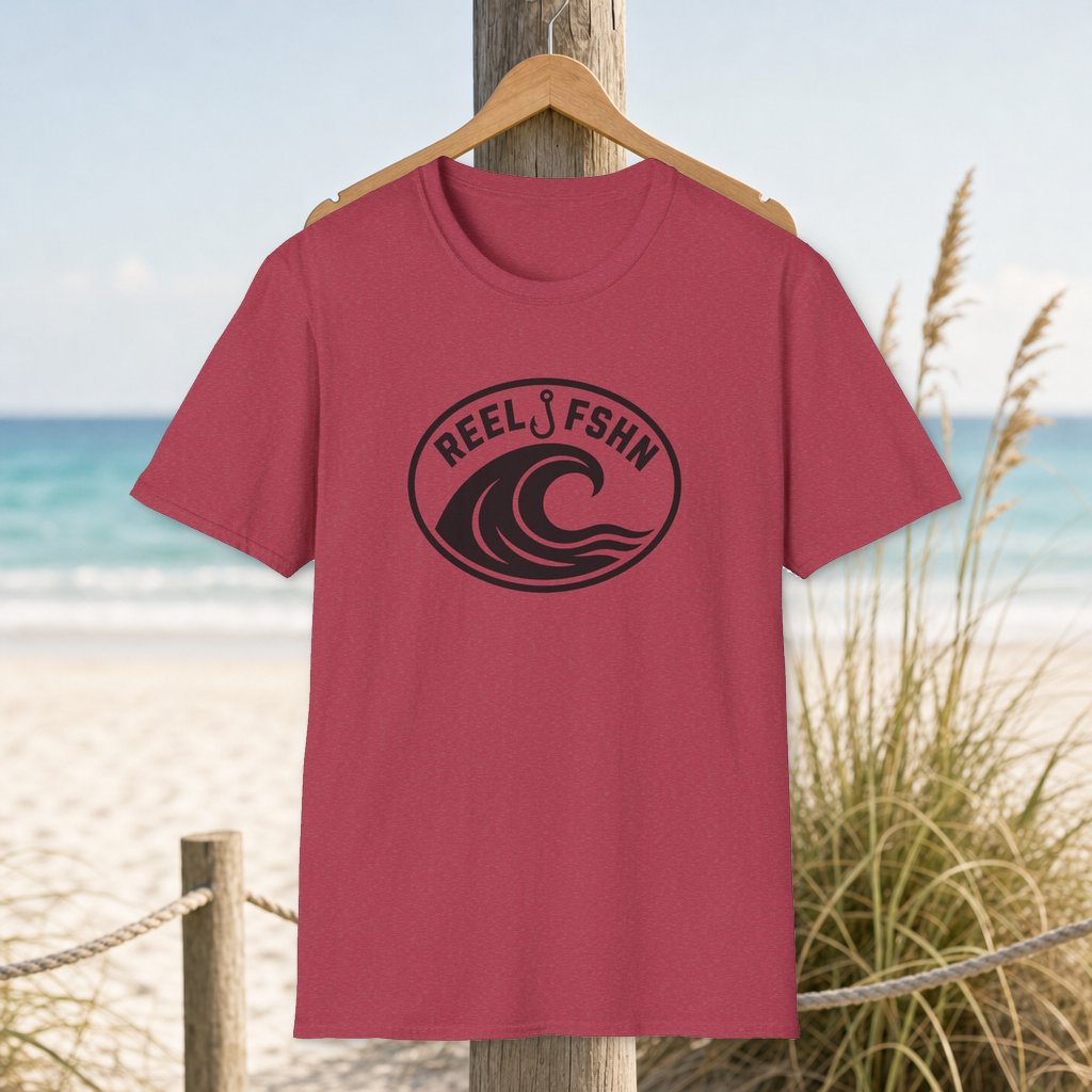 Wave & Hook with Logo T-Shirt on a hanger beside a sandy beach and turquoise coastal water