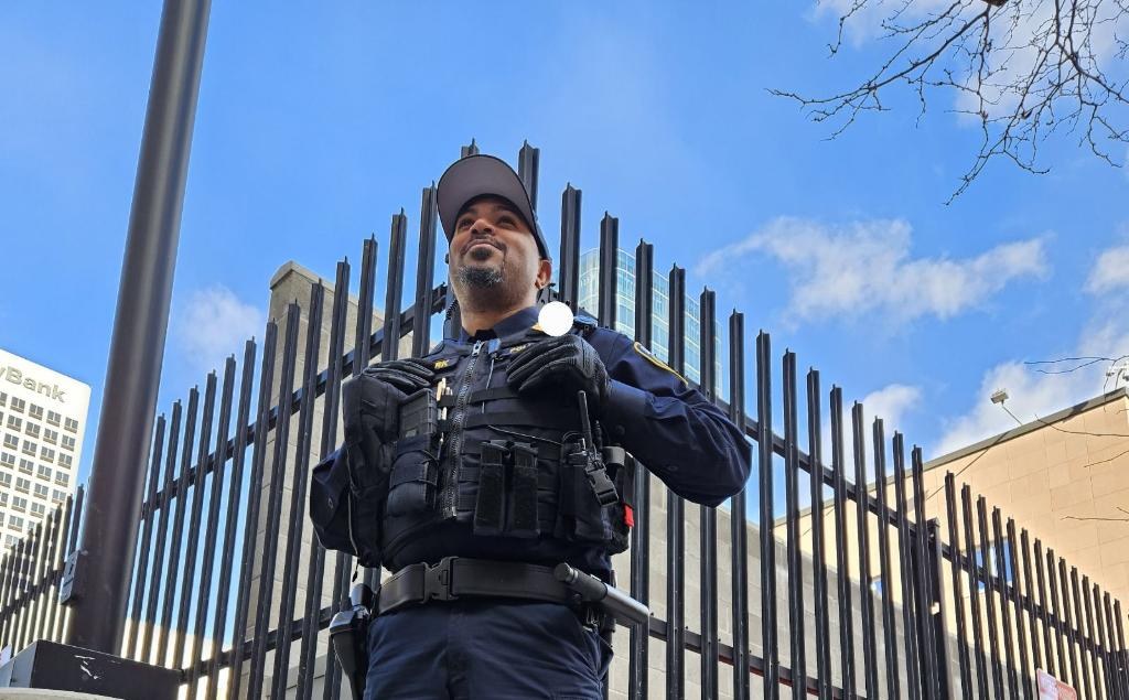 Uniformed security team member outside a property
