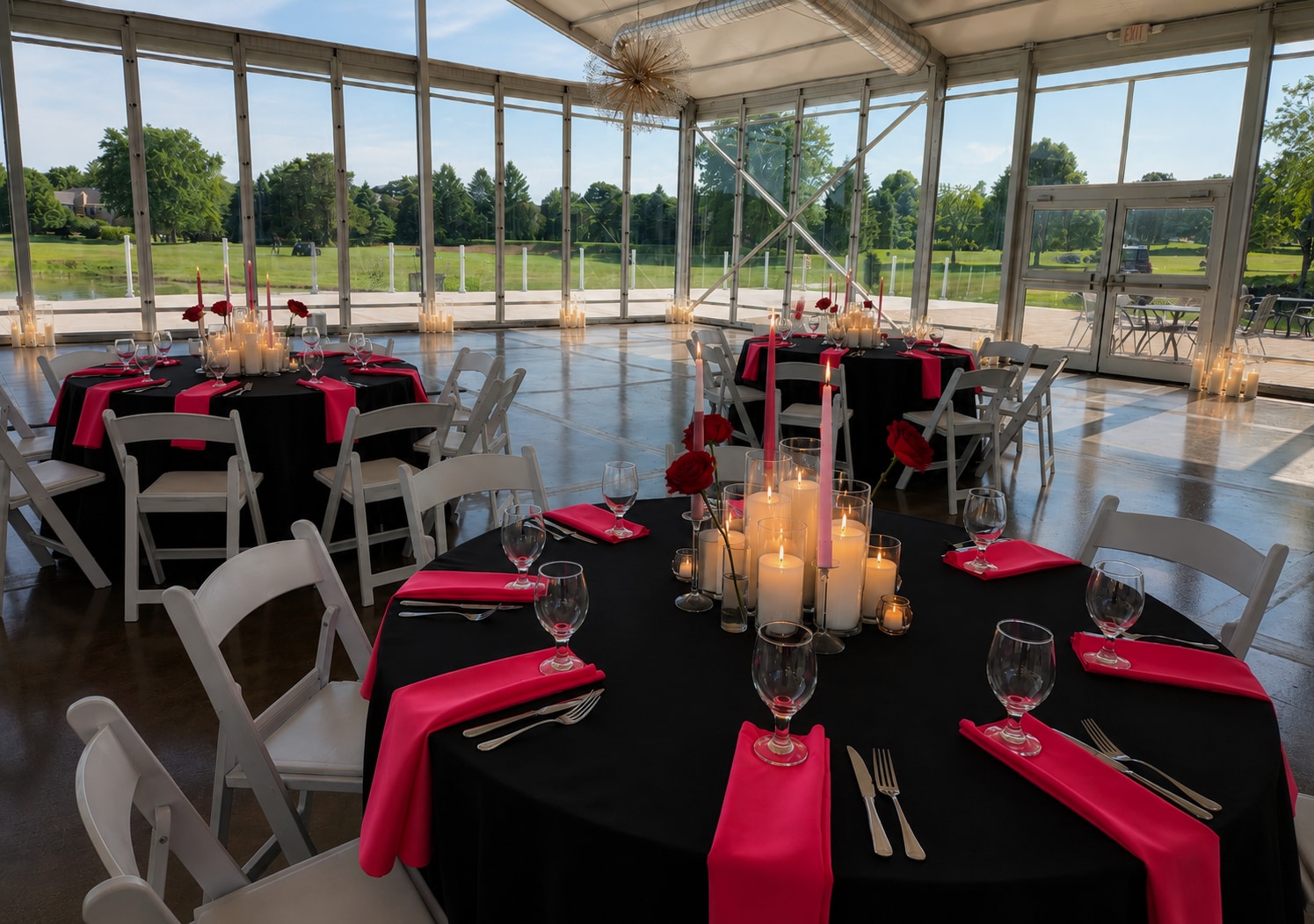 Candlelit celebration with black and pink tablecloths and layered candlelight